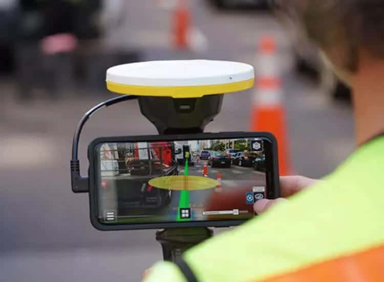 a person holding a phone to a camera