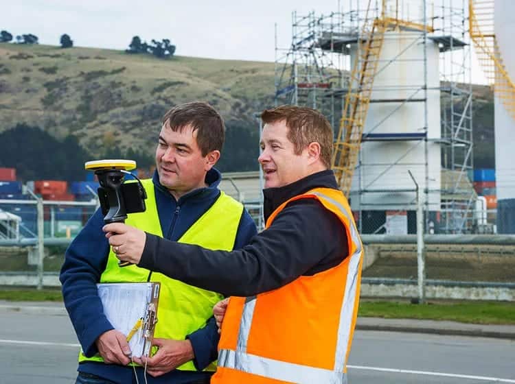 a man holding a device to another man